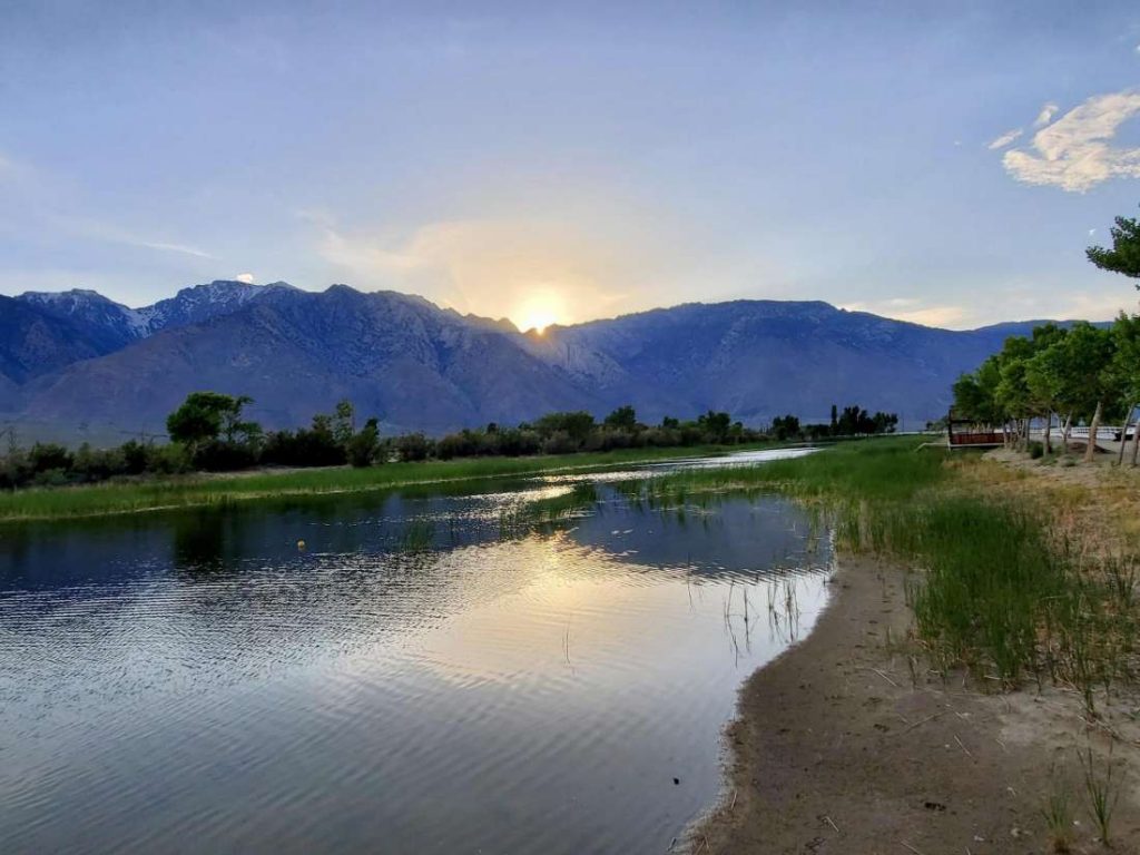 the sun setting behind the sierra mountains, view from lake olancha