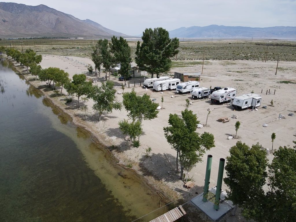 drone shot at rv's parked at lake olancha
